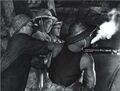 中国人民解放军铁道兵部队战士在导坑内施工。载于1971年第1期《人民画报》。