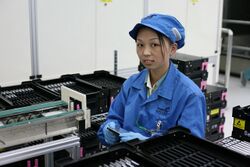 Worker at Seagate tests drives.jpg