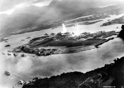 A photograph by an airplane of the Imperial Japanese Navy, facing east over Battleship Row. 7 November 1941.