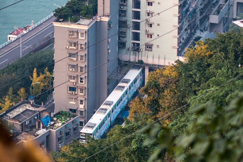 File:A train of Chongqing Rail Transit Line 2 coming through a residential building at Liziba.jpg